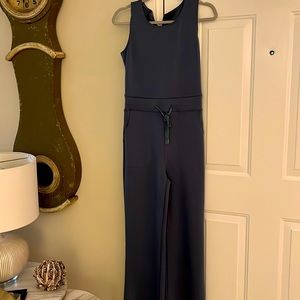 One piece sleeveless jumpsuit with drawstring waist.  new never worn.